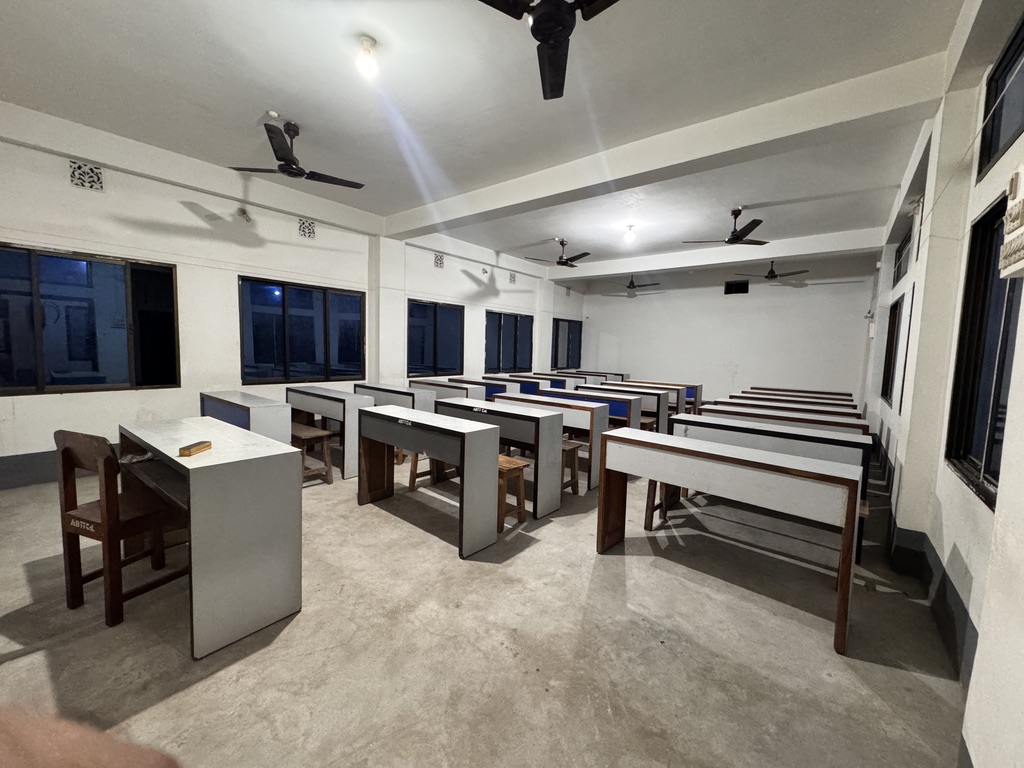 Mathematics method room with geometric solids, globe and Bengali charts
