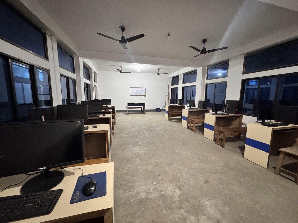 Computer lab with rows of desktop workstations