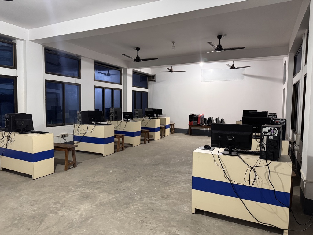 Wide view of the ICT room with desktop computers and CPUs