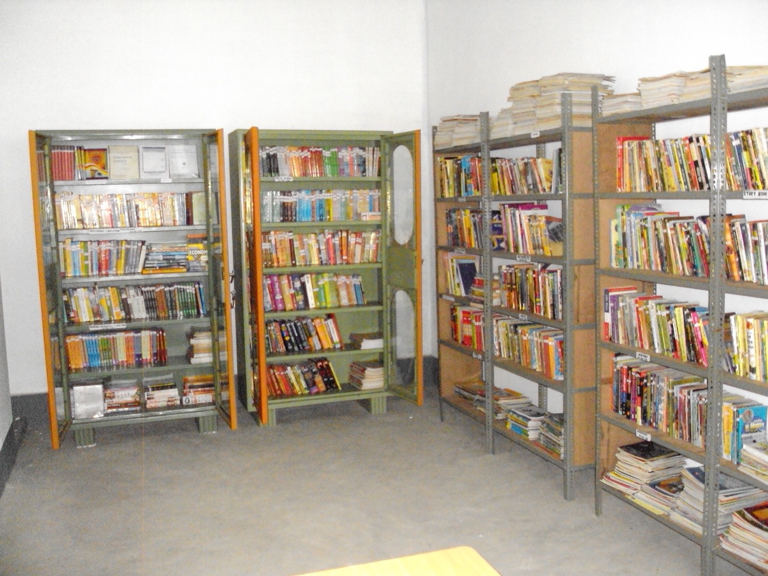 Library stacks with books arranged by subject